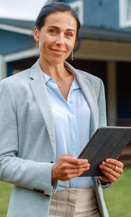 Real estate agent smiling with tablet