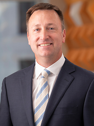 A person in front of a background.